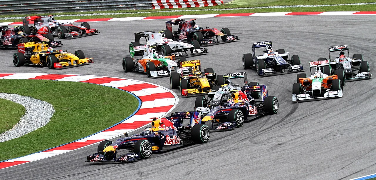 Formula 1 cars at the start of the 2010 Malaysian Grand Prix